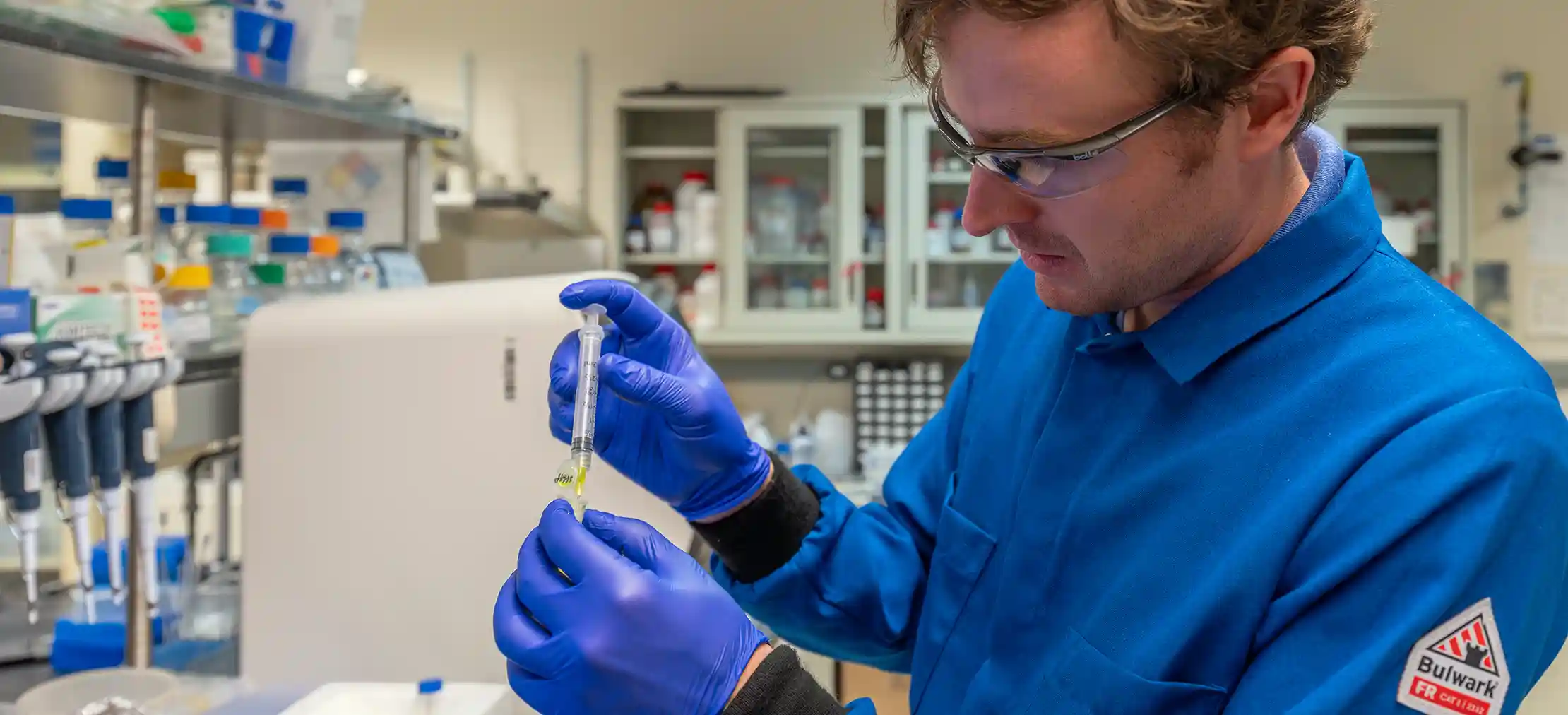 Bioengineering researcher prepares a protein sample for purification.
