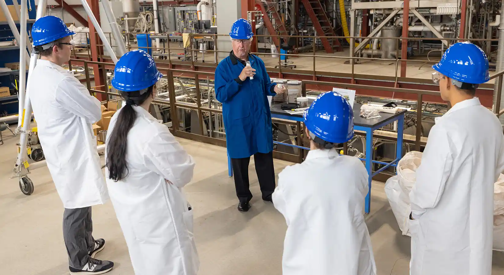 Biotechnology researchers give a tour of the lab.