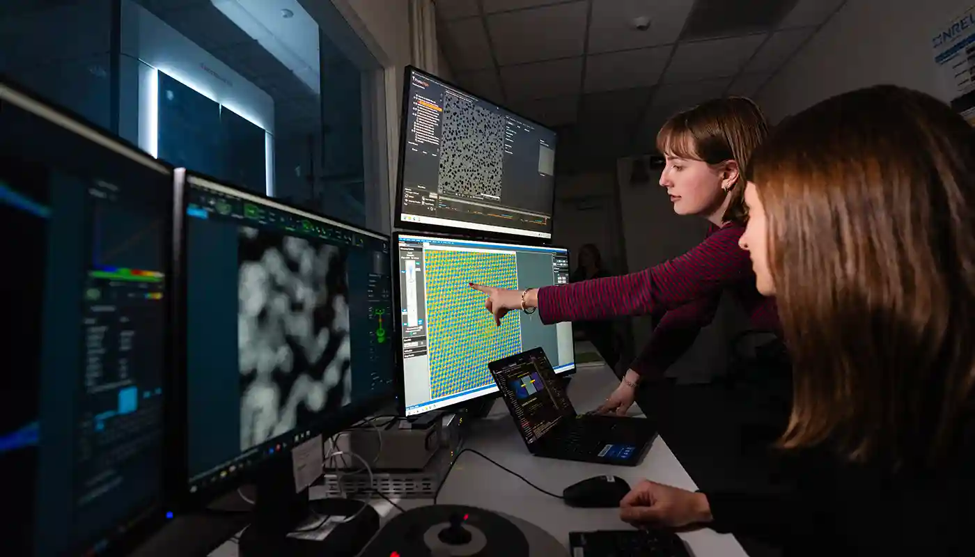 Researchers work on autonomous electron microscopy at the National Laboratory of the Rockies (NLR).