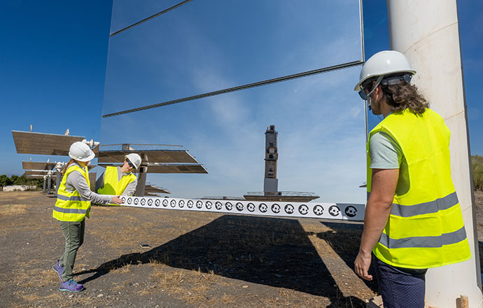 Workers align test shots for the Non-Intrusive Optical imaging system.