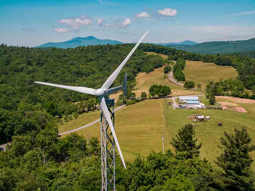 A small wind turbine near a farm