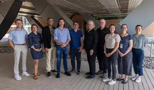 Continue reading about A group of people posing for a picture