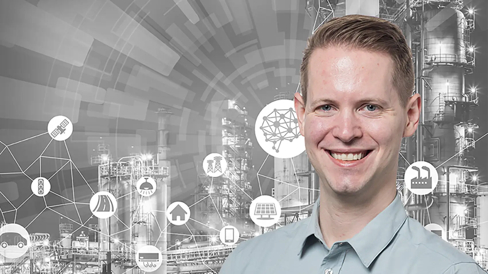 Portrait of Paul Meyer in front of manufacturing graphic.