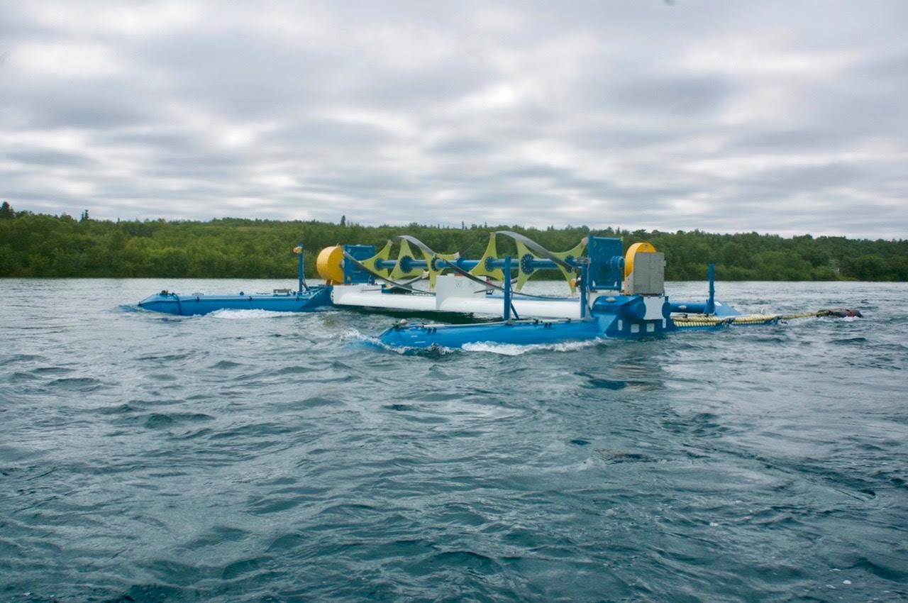 Photo of RivGen power system floating on the surface of a river with trees in the background.