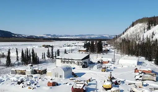 Continue reading about An aerial image of Hughes, Alaska, in the snow.