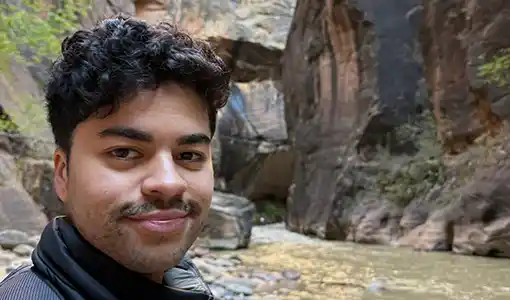 Portrait of Patrick Emami hiking.