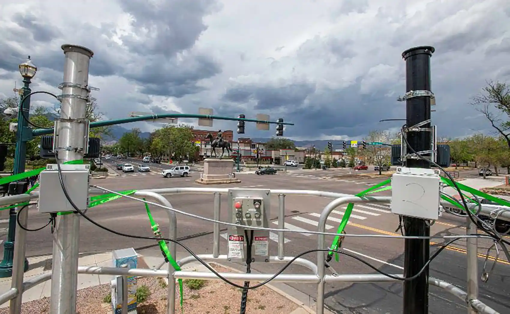 20260824-multisensor-data-fusion-optimizes-traffic-flow-and-intersection-safety-delivering-cost-and-time-savings-co-springs-intersection Scientific equipment attached to poles near intersection.