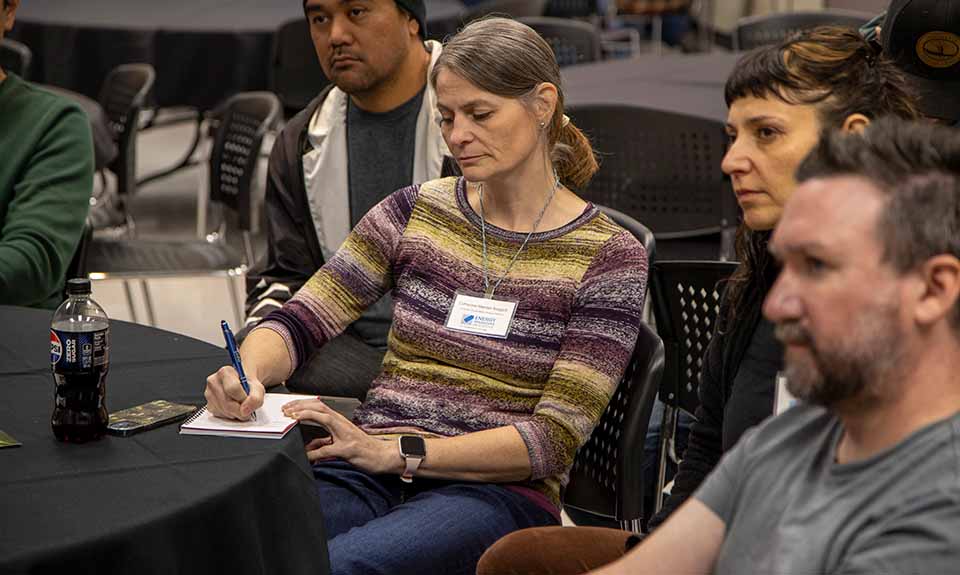 A group of people sitting in chairs.