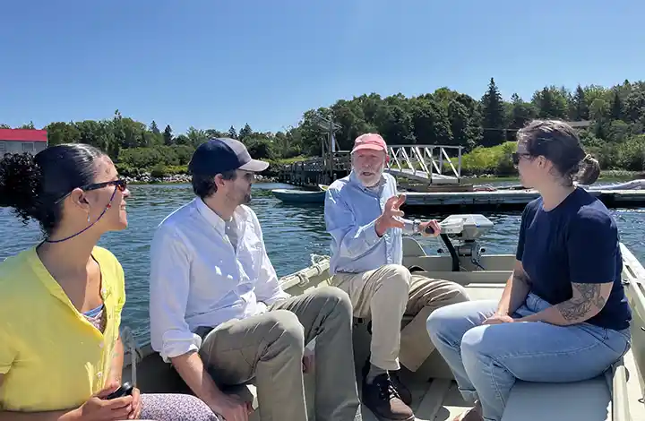Four people on a boat.