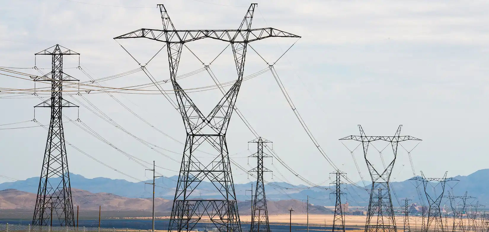 Power poles and lines spread across the plains